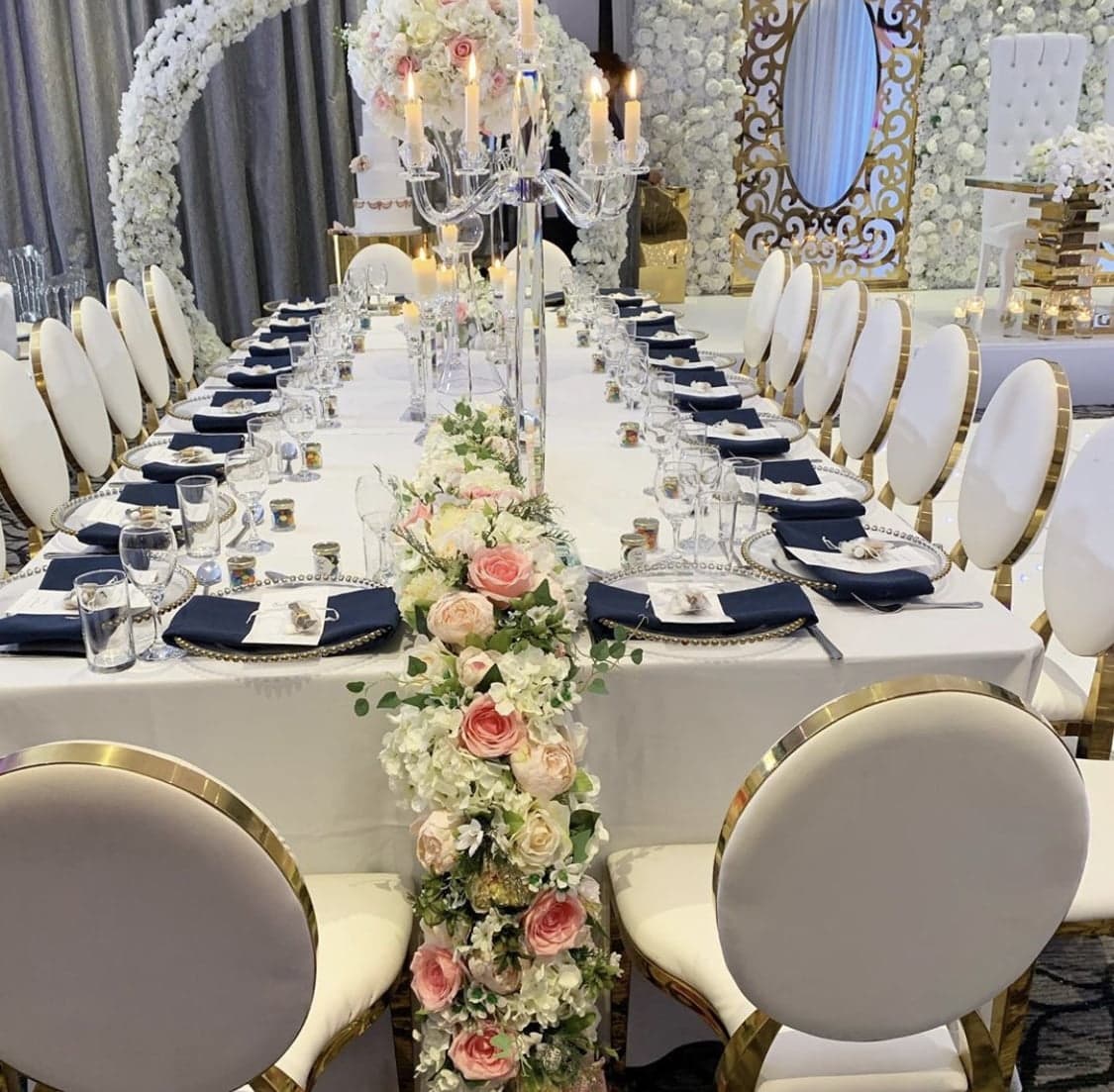 Long banquet table with floral centrepieces